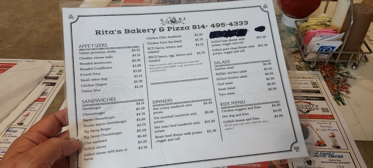 Rita's Bakery & Pizza menu board