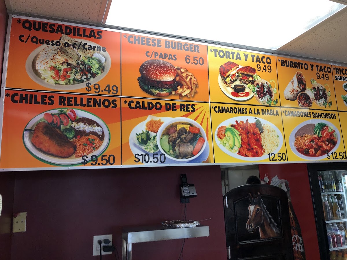 El Canelo Tacos y Mariscos menu board