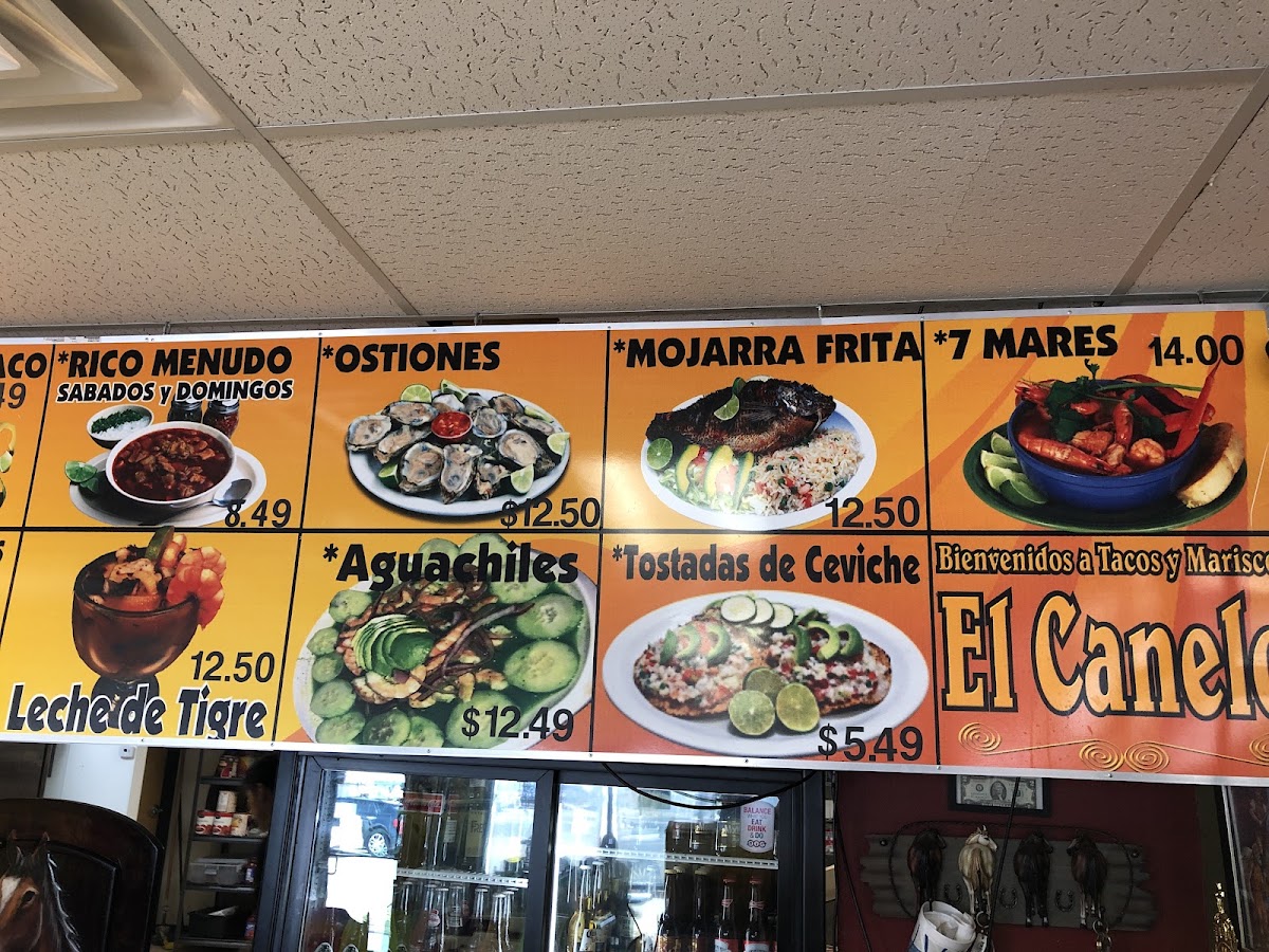 El Canelo Tacos y Mariscos menu board