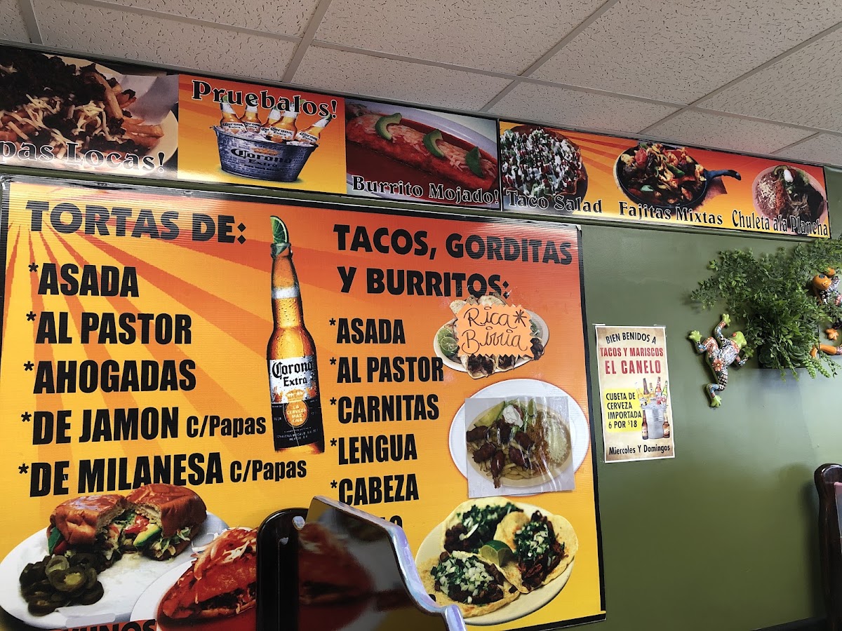 El Canelo Tacos y Mariscos menu board