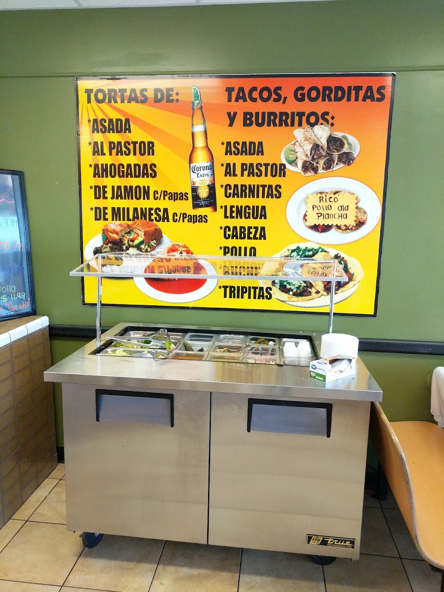 El Canelo Tacos y Mariscos menu board