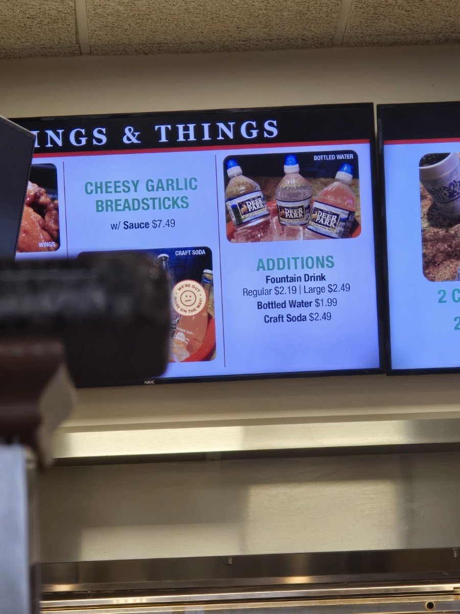 Papi's Pizza and Subs menu board