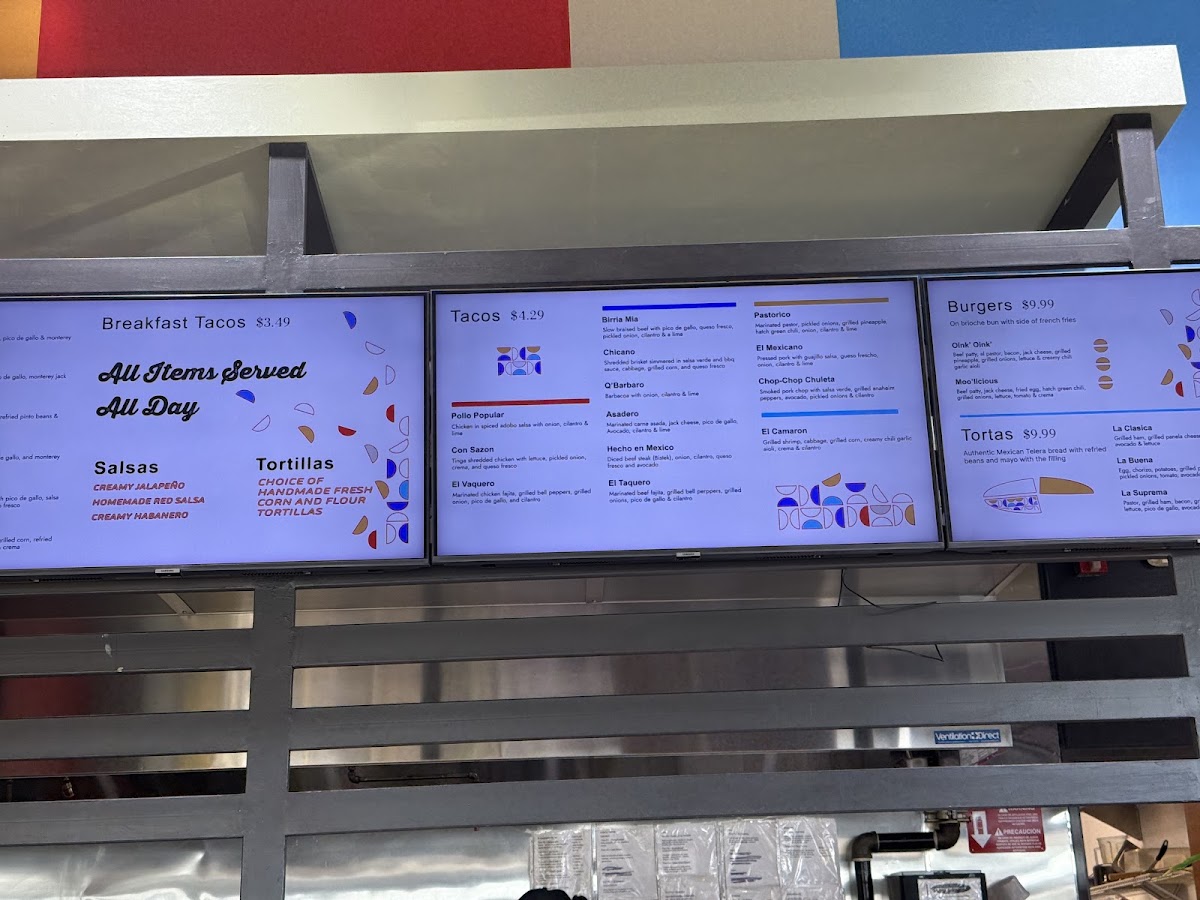 Que Rico Tacos y Mas menu board