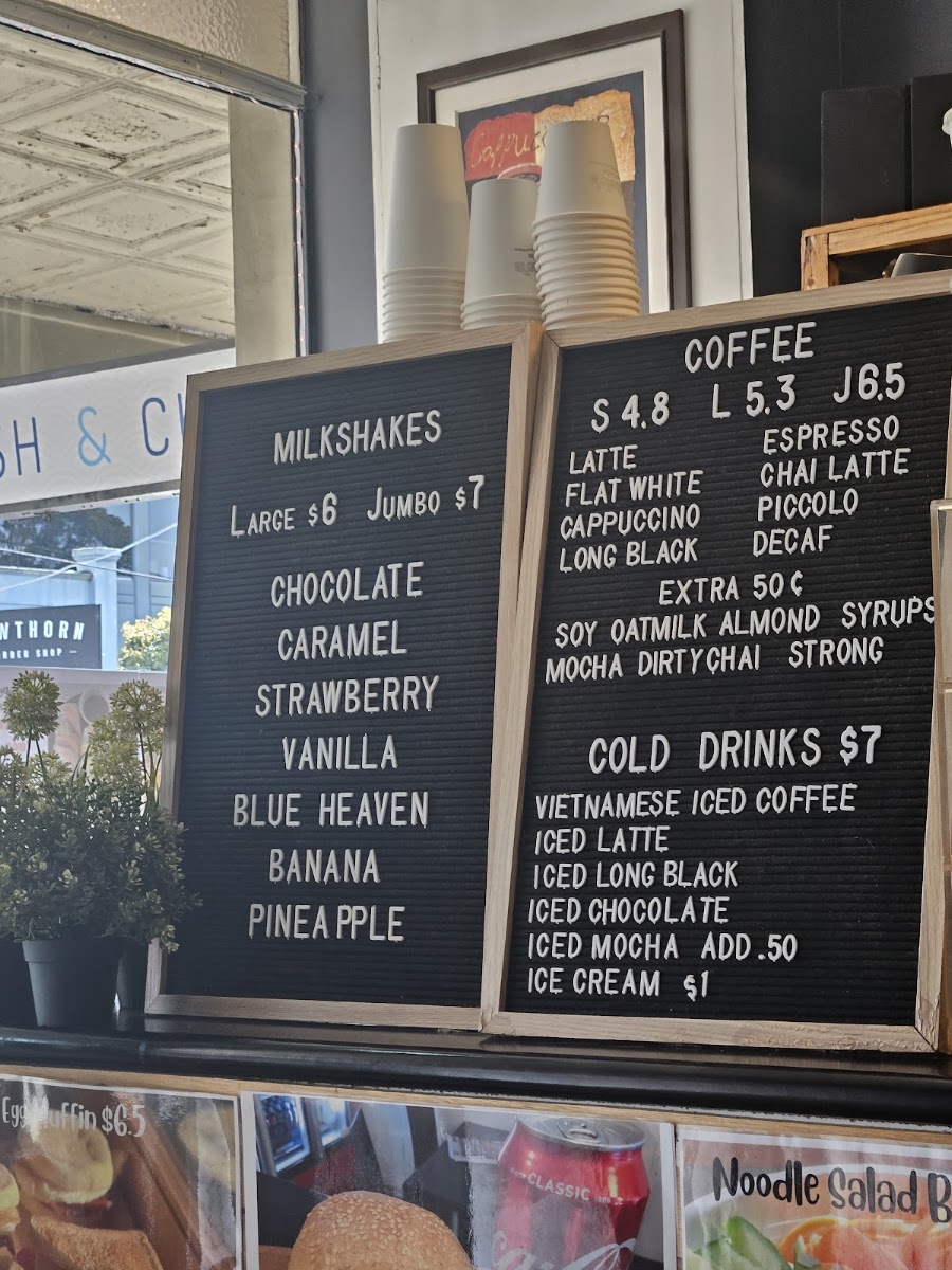 Michelle's Rolls & Coffee menu board