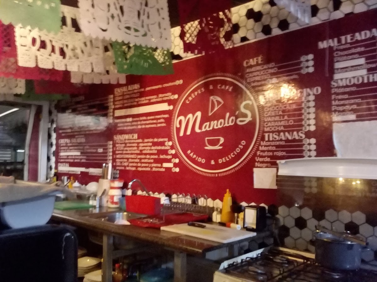 Manolo's Crêpes & Café menu board