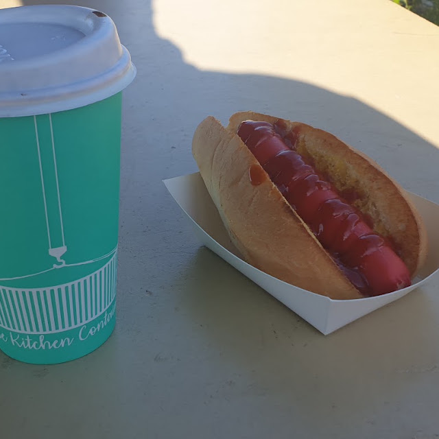 Hot Dog in Toasted Roll and Cappuccino