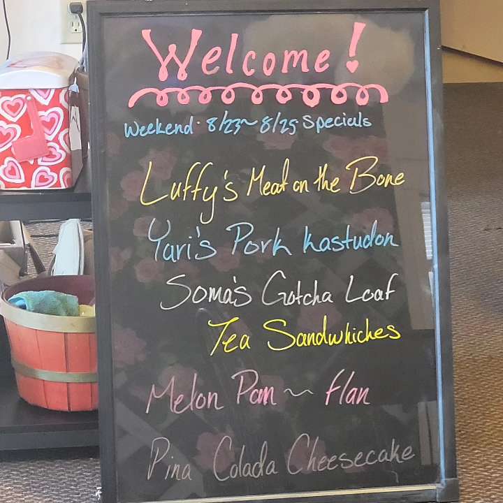 At Your Service Maid Cafe menu board