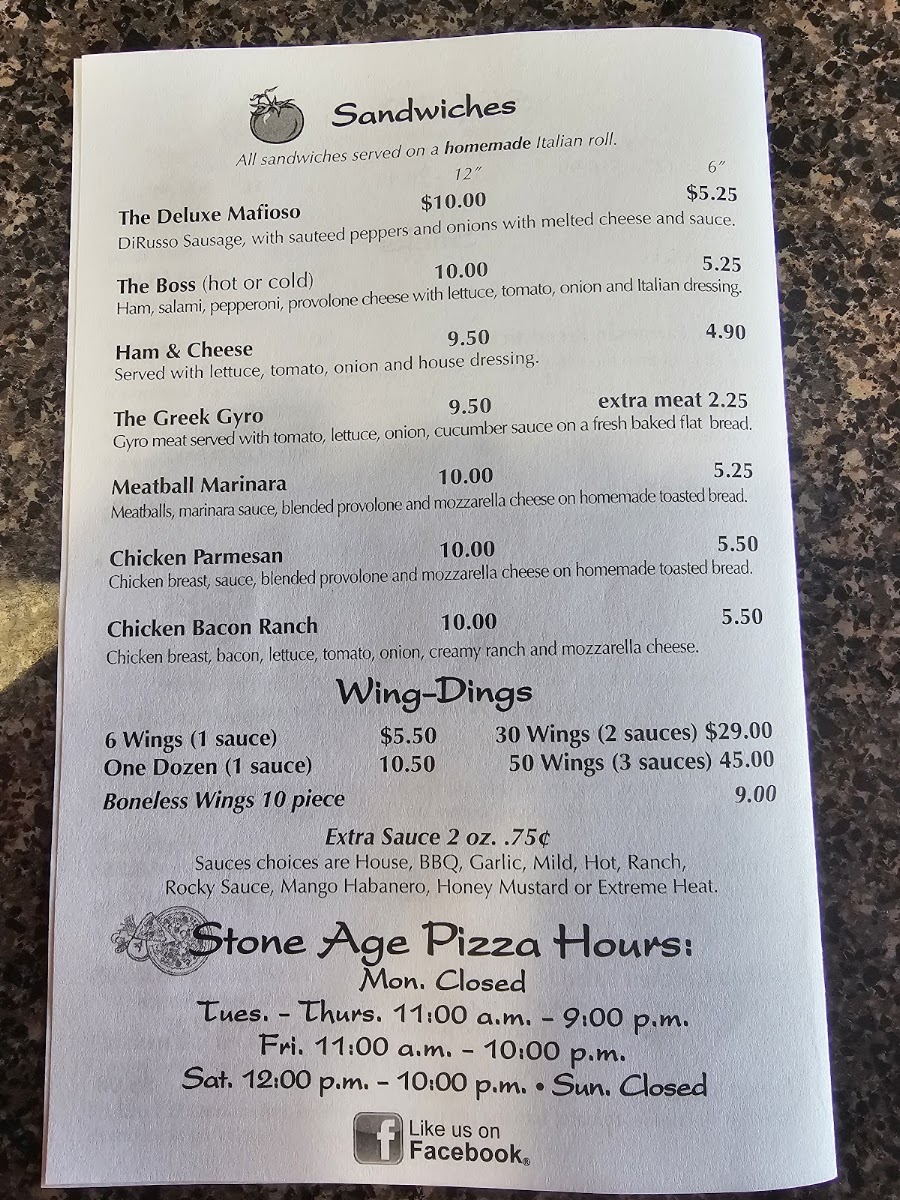 Stone Age Pizza menu board