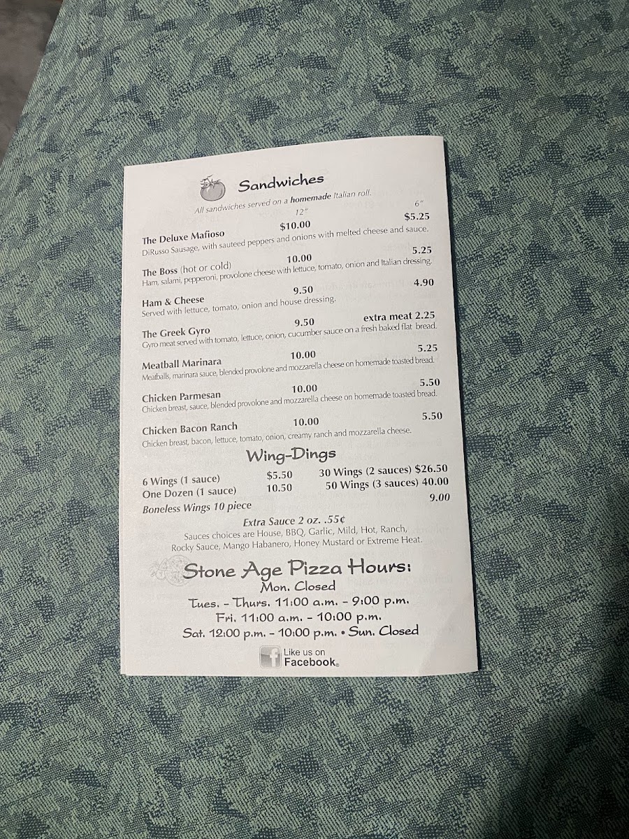 Stone Age Pizza menu board