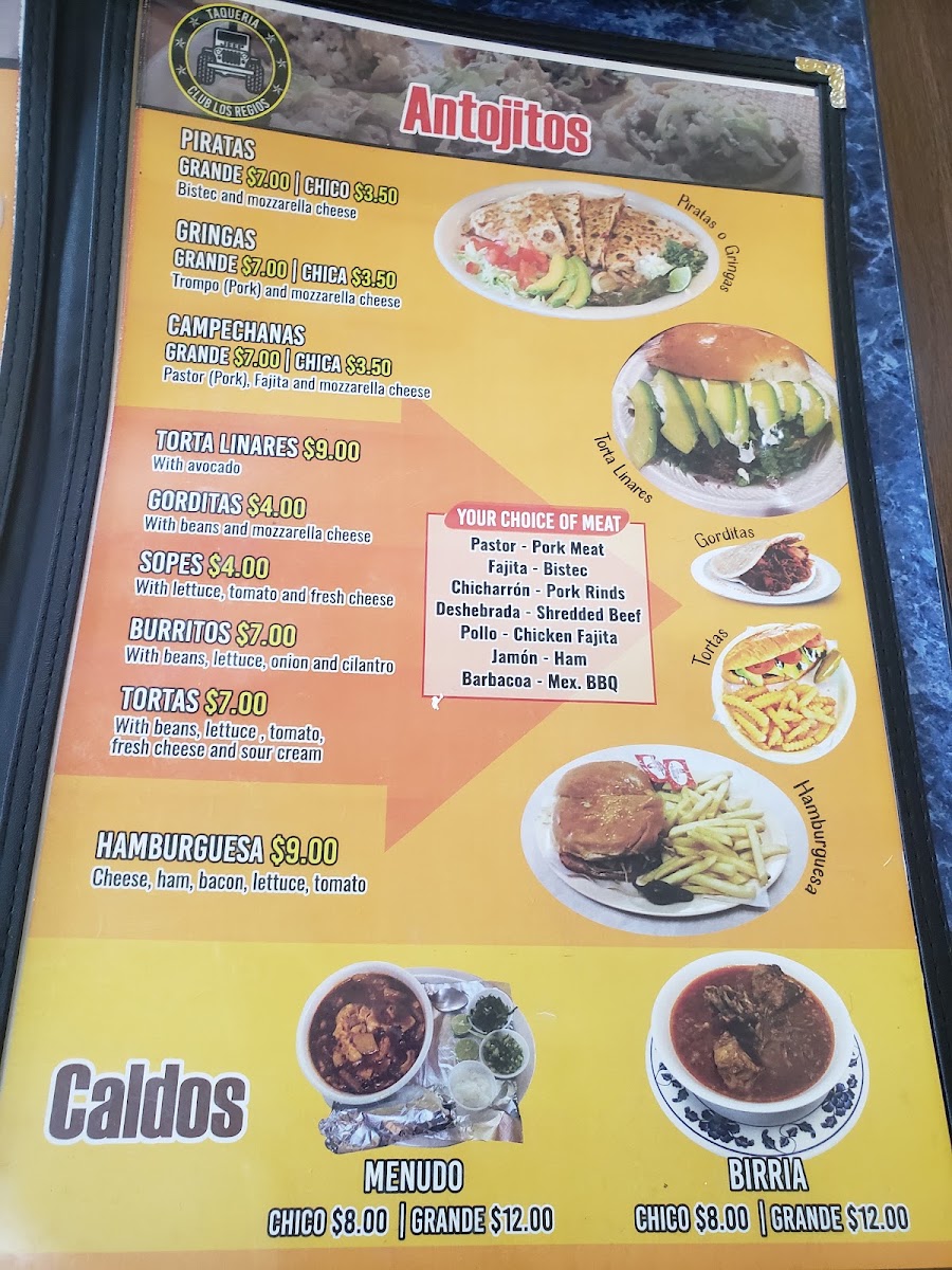 Taquería Club Los Regios menu board