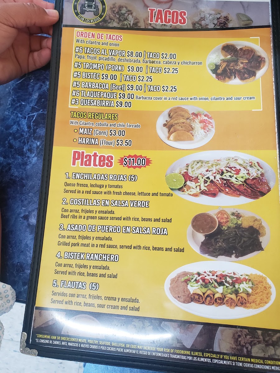 Taquería Club Los Regios menu board