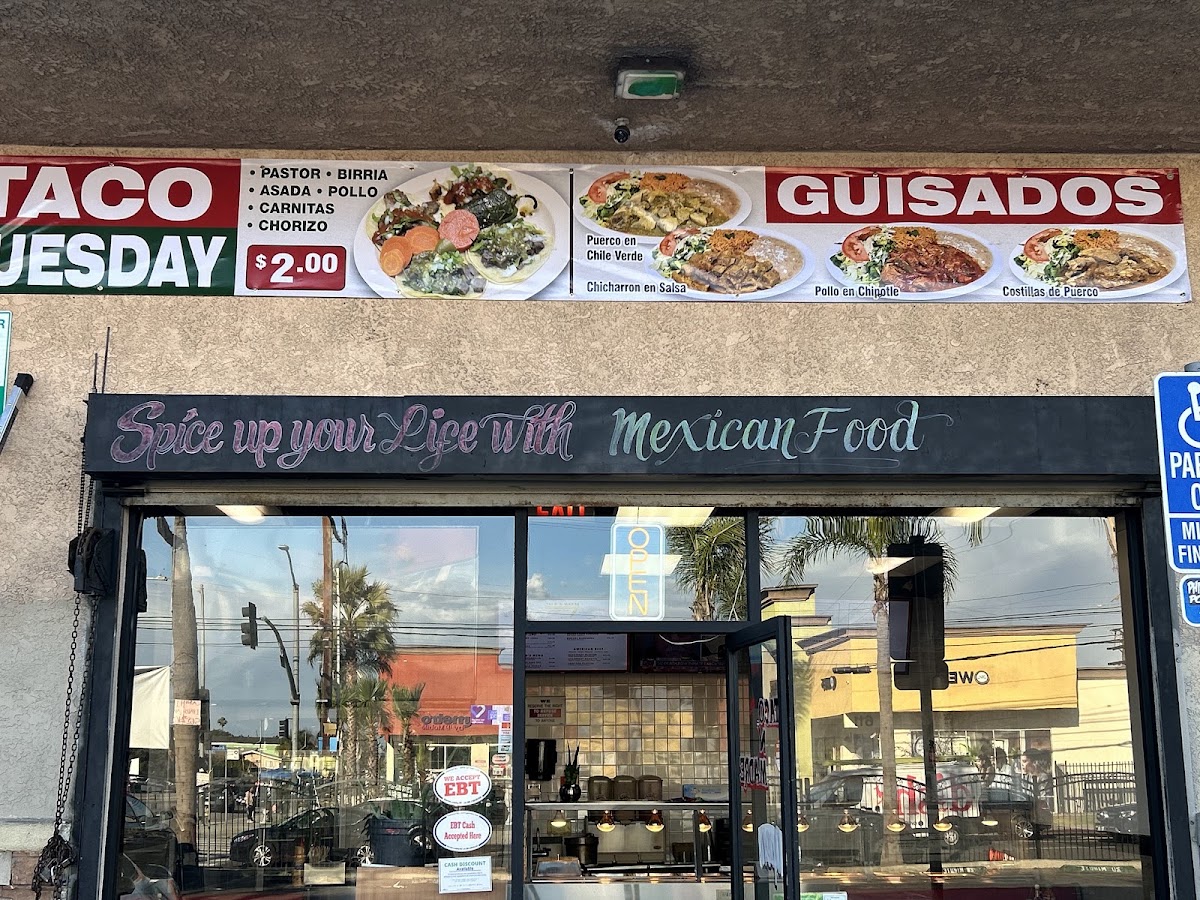 Guisados Mexican Grill menu board