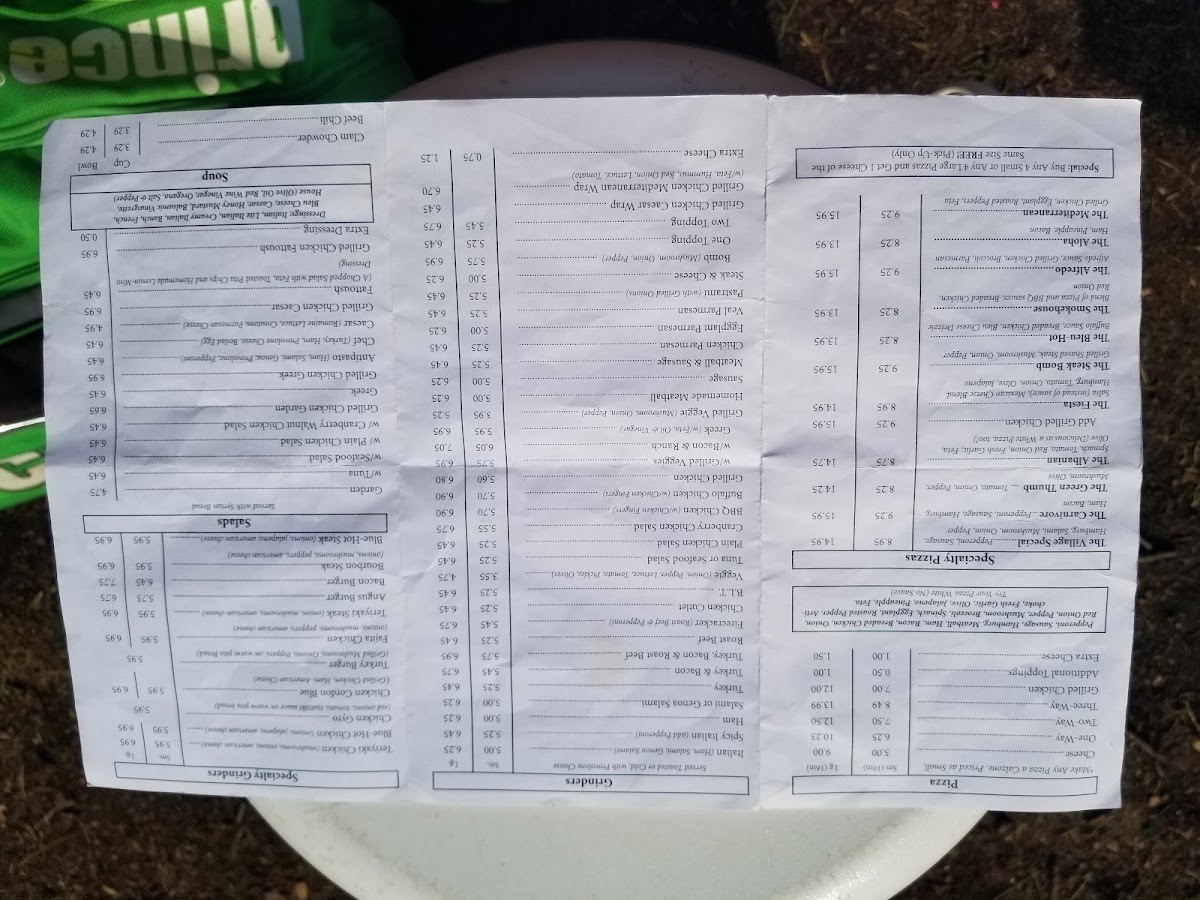 The Original Village Pizza menu board