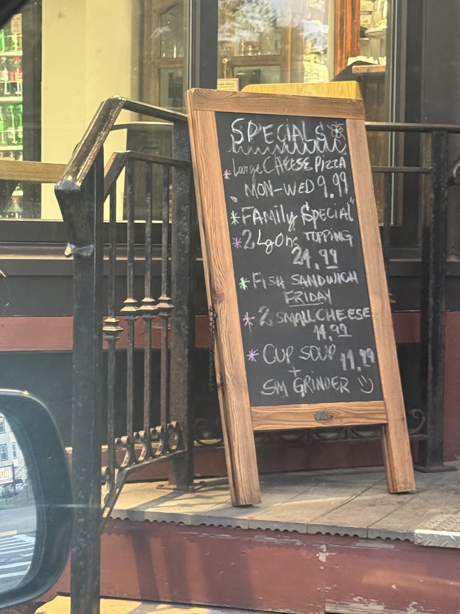 The Original Village Pizza menu board