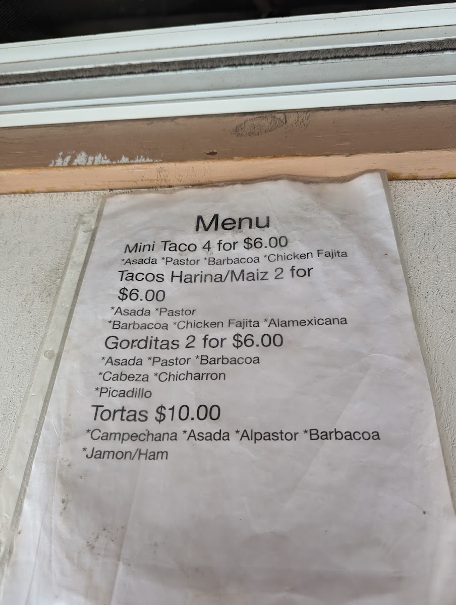 Taqueria Taco Rico menu board