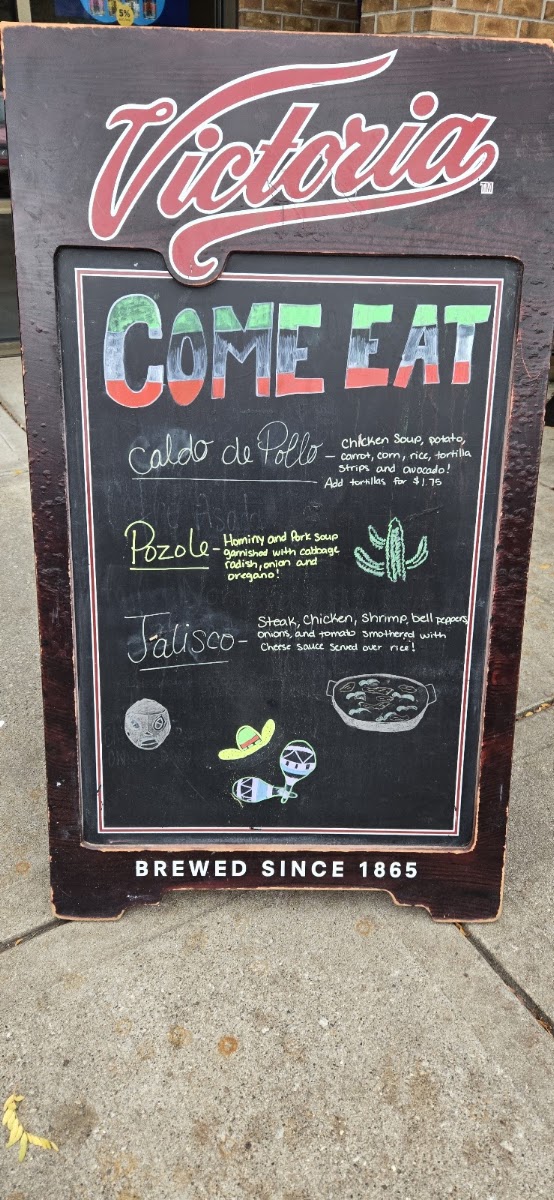 Santo Taco menu board