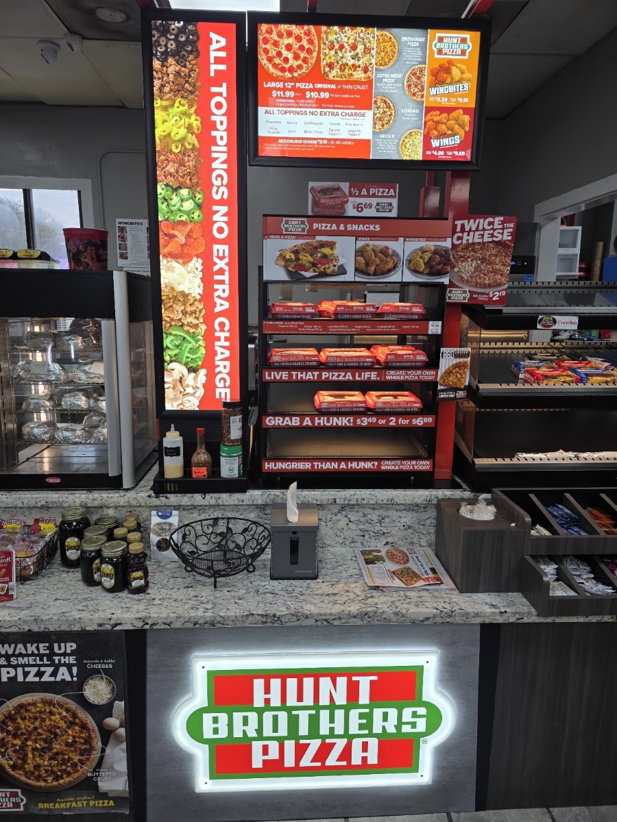 Hunt Brother's Pizza menu board