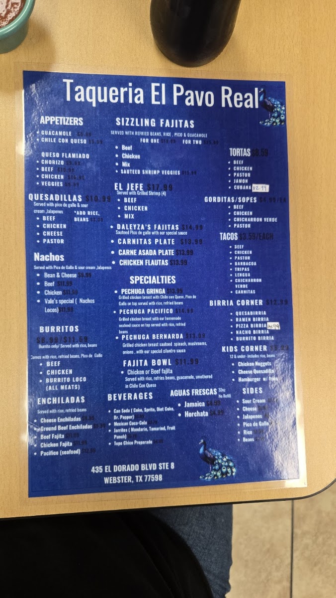Taqueria El Pavo Real menu board