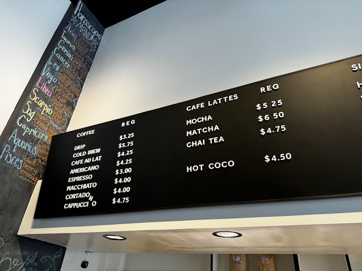 Nosy Neighbors Coffee & Donuts menu board