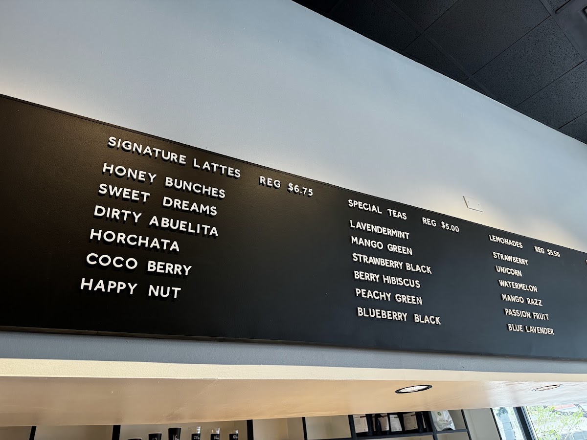 Nosy Neighbors Coffee & Donuts menu board