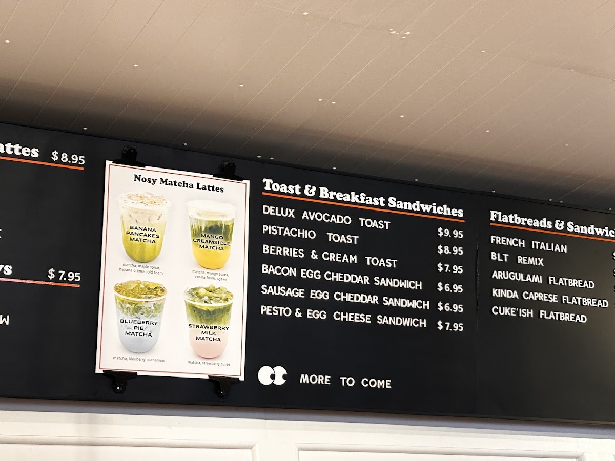 Nosy Neighbors Coffee & Donuts menu board