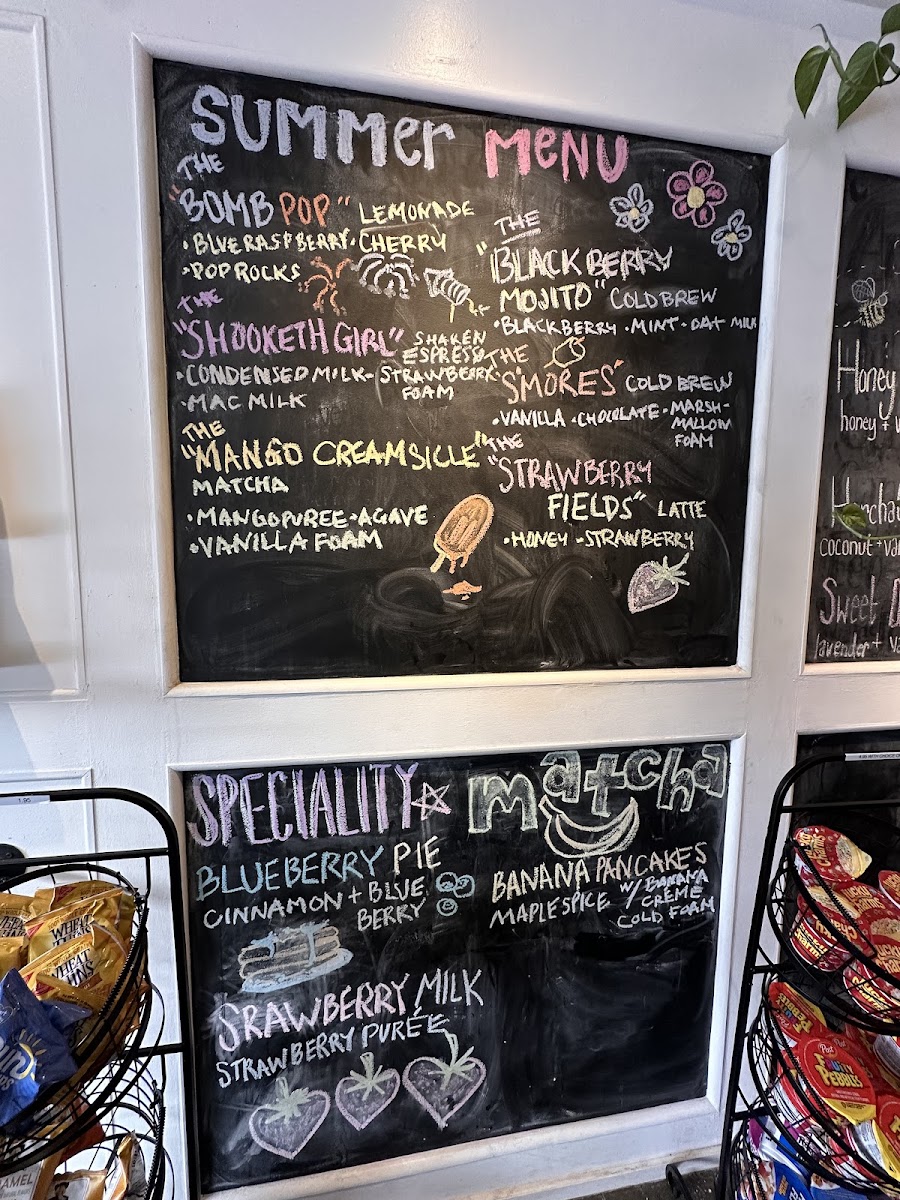Nosy Neighbors Coffee & Donuts menu board