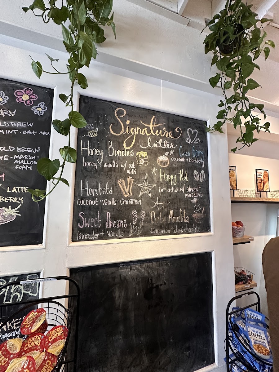 Nosy Neighbors Coffee & Donuts menu board