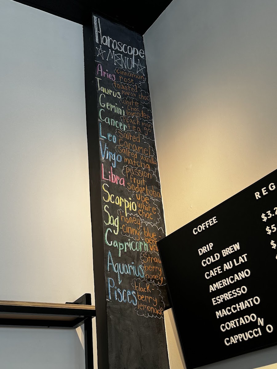 Nosy Neighbors Coffee & Donuts menu board