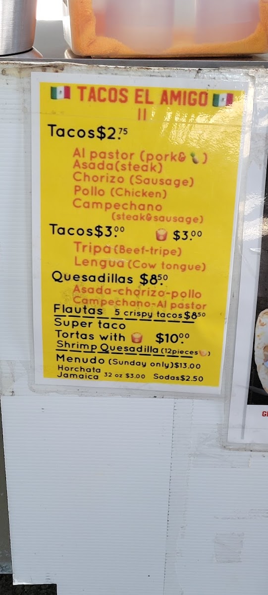 Tacos El Amigo menu board