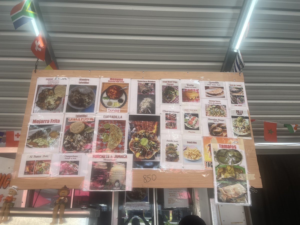 Tacos El Amigo menu board