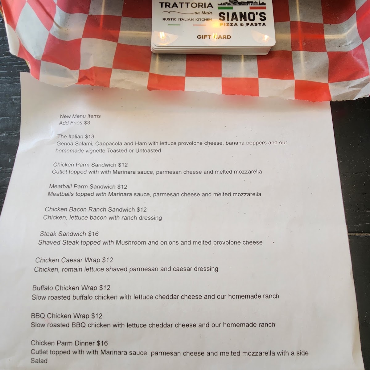 Siano's Pizza and Pasta menu board