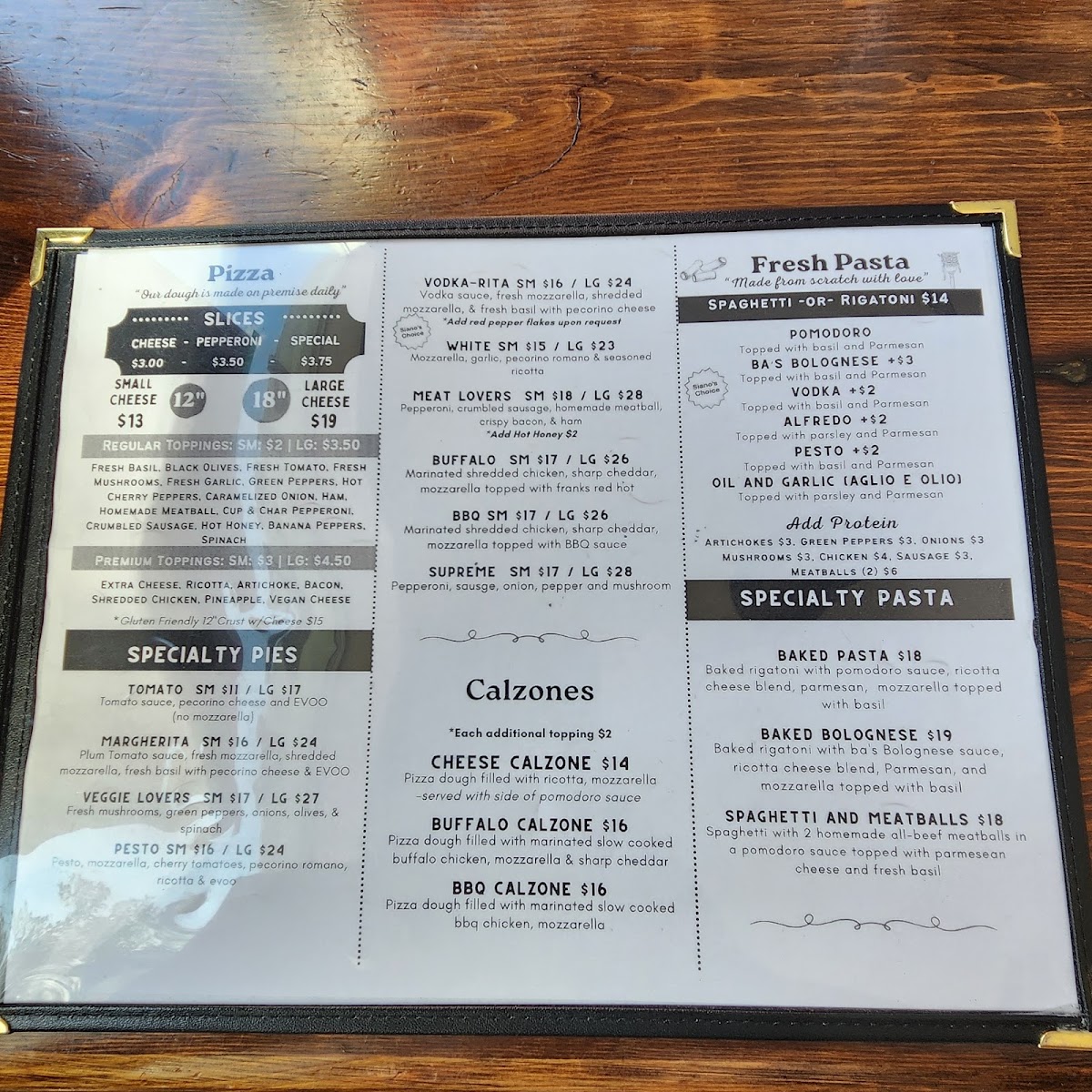 Siano's Pizza and Pasta menu board