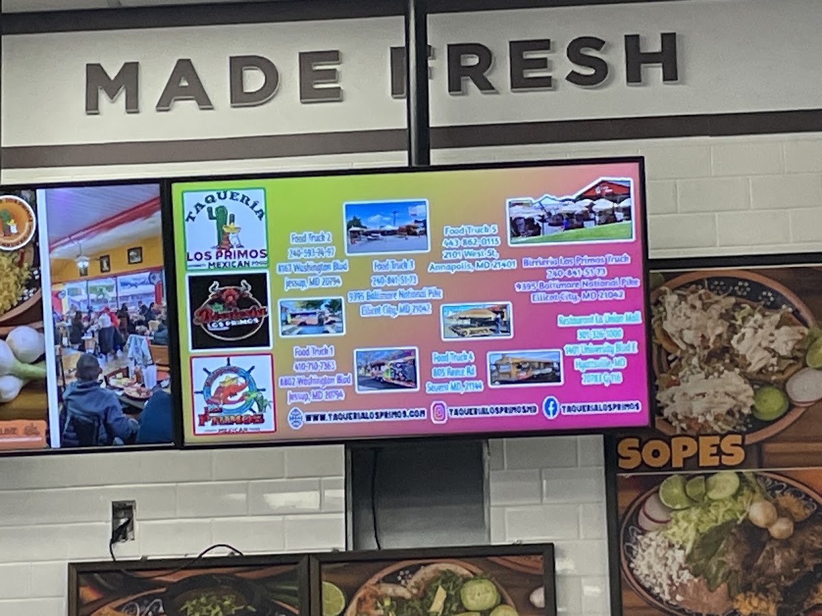 Taqueria Los Primos menu board