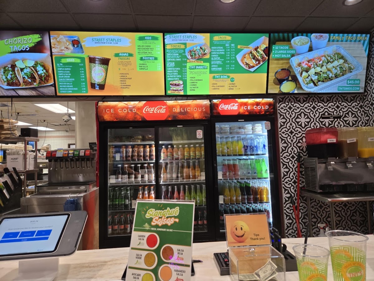 TNT's Tacos N' Tortas menu board