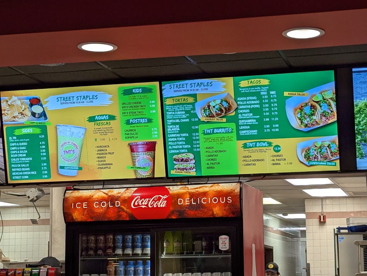 TNT's Tacos N' Tortas menu board