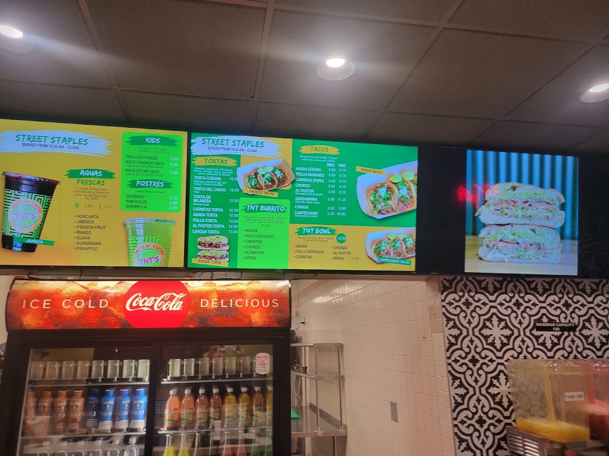 TNT's Tacos N' Tortas menu board