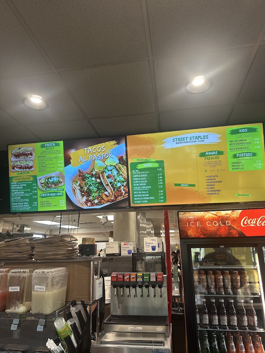 TNT's Tacos N' Tortas menu board