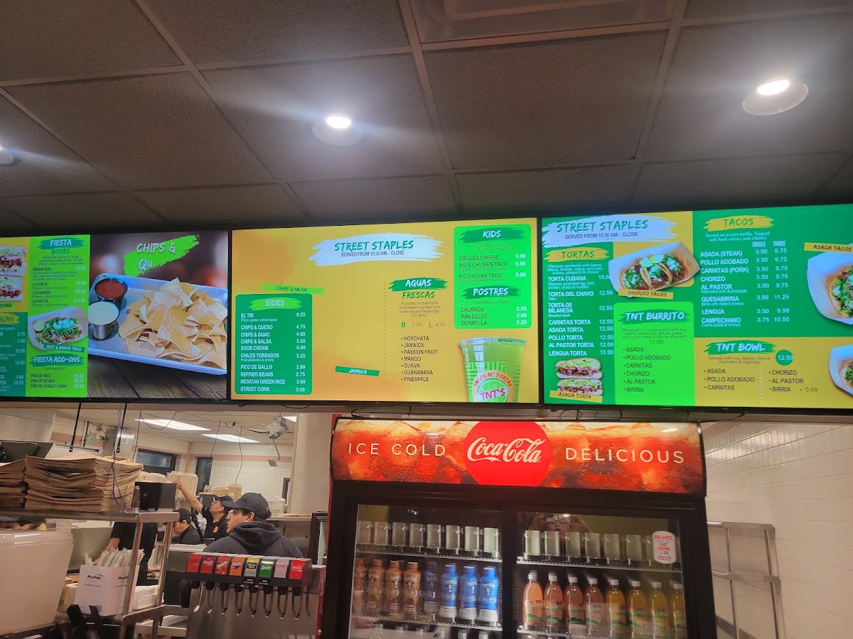TNT's Tacos N' Tortas menu board