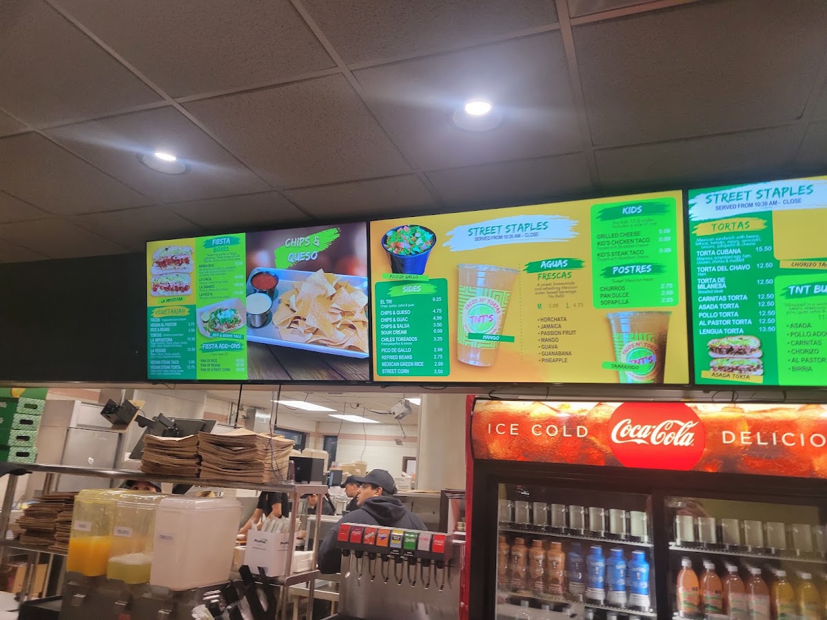 TNT's Tacos N' Tortas menu board