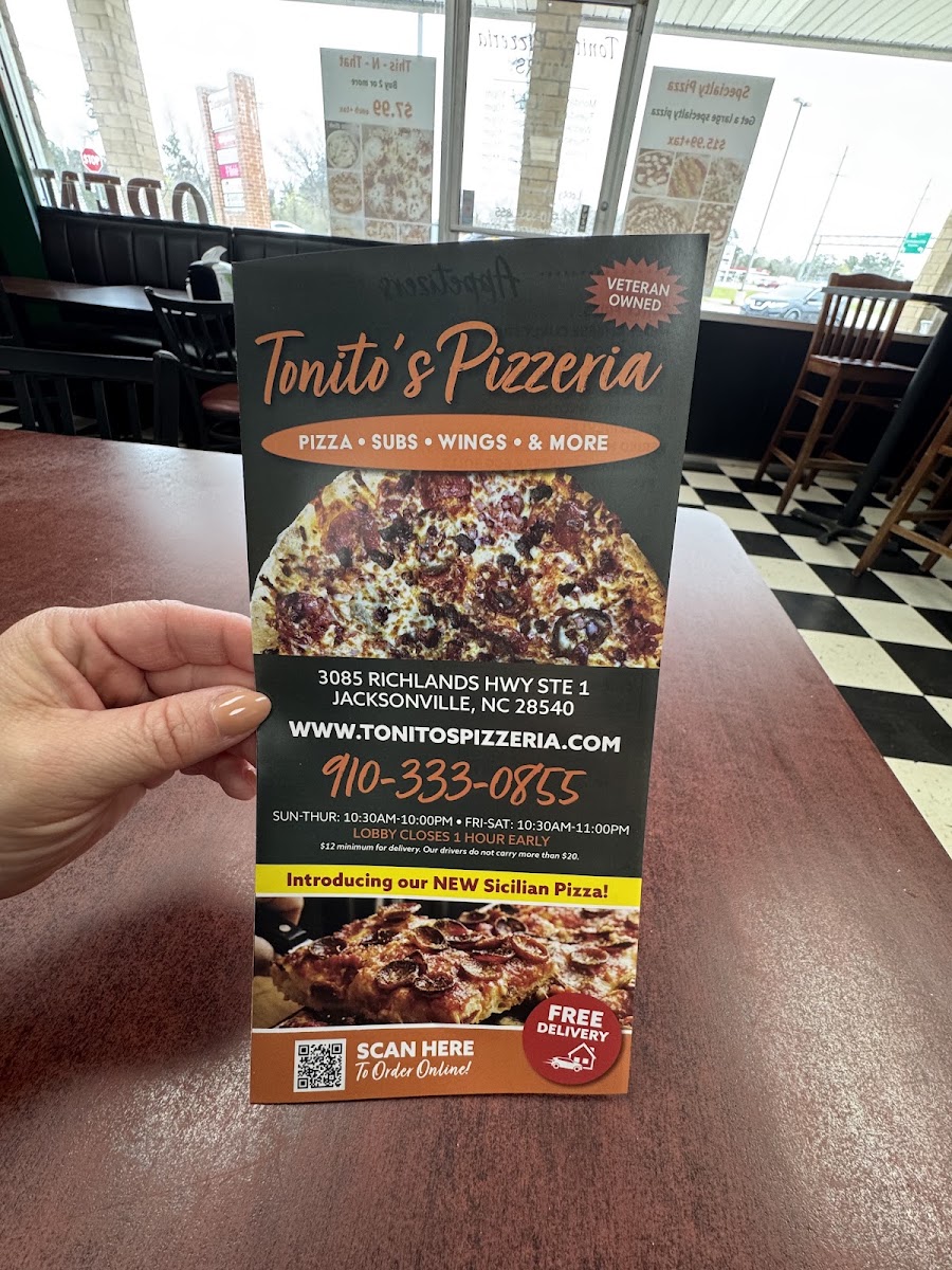 Tonito's Pizzeria menu board