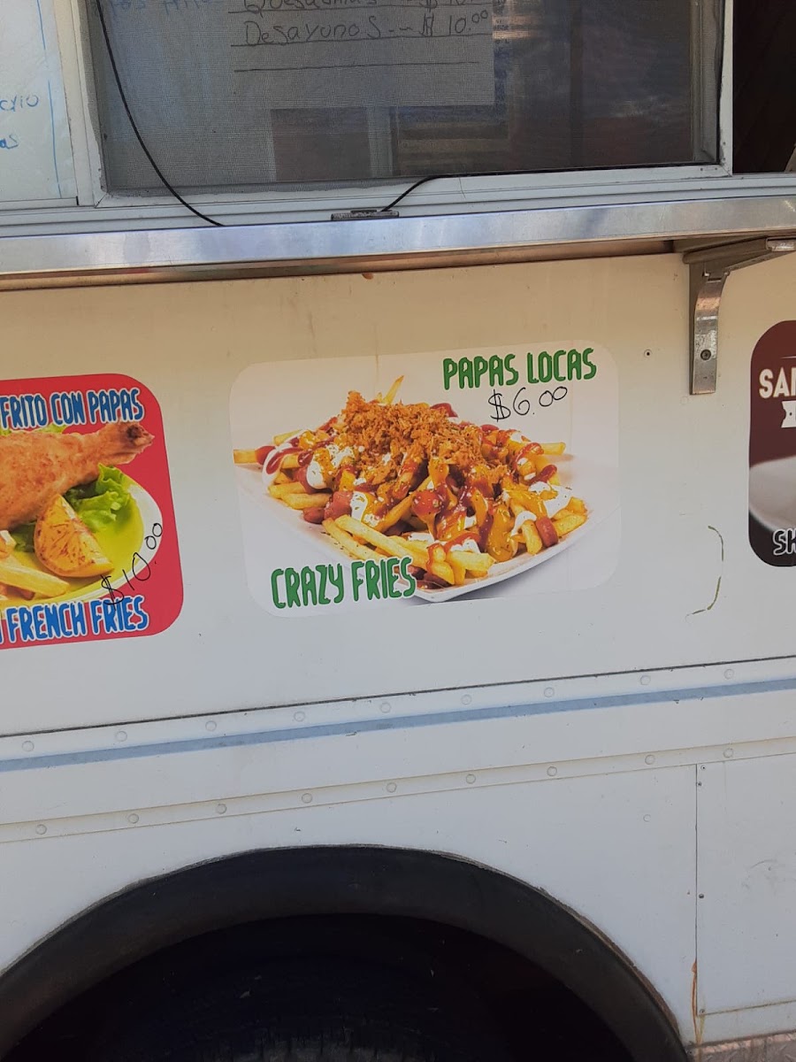 Kely's Taqueria y Pupuseria menu board