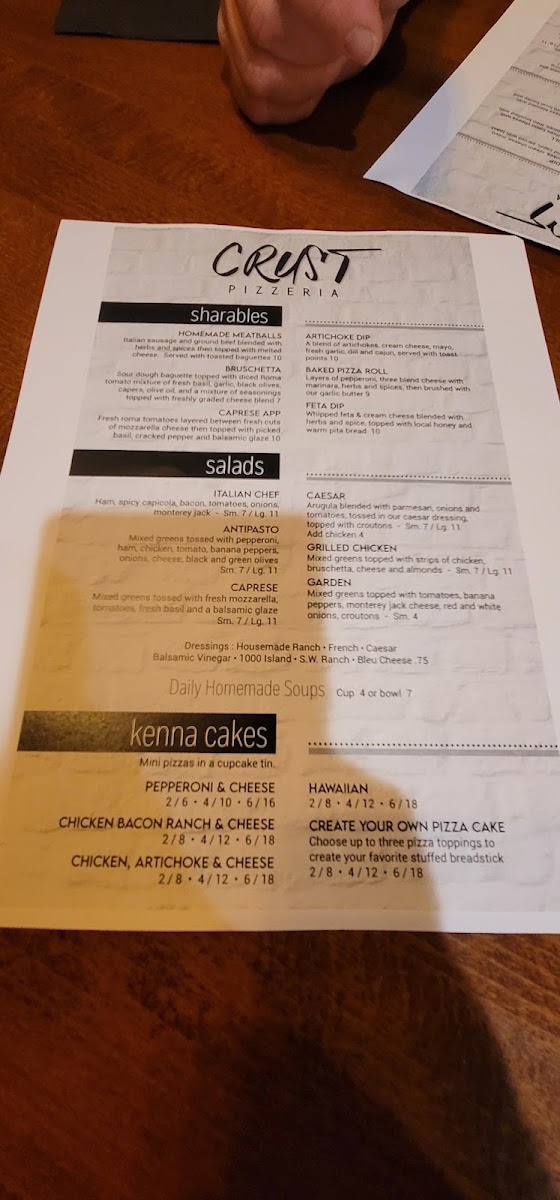 Crust Pizzeria menu board