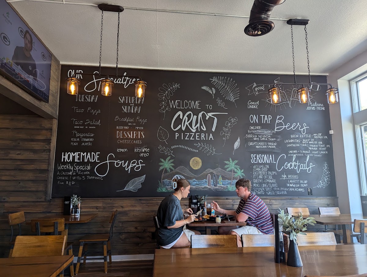 Crust Pizzeria menu board