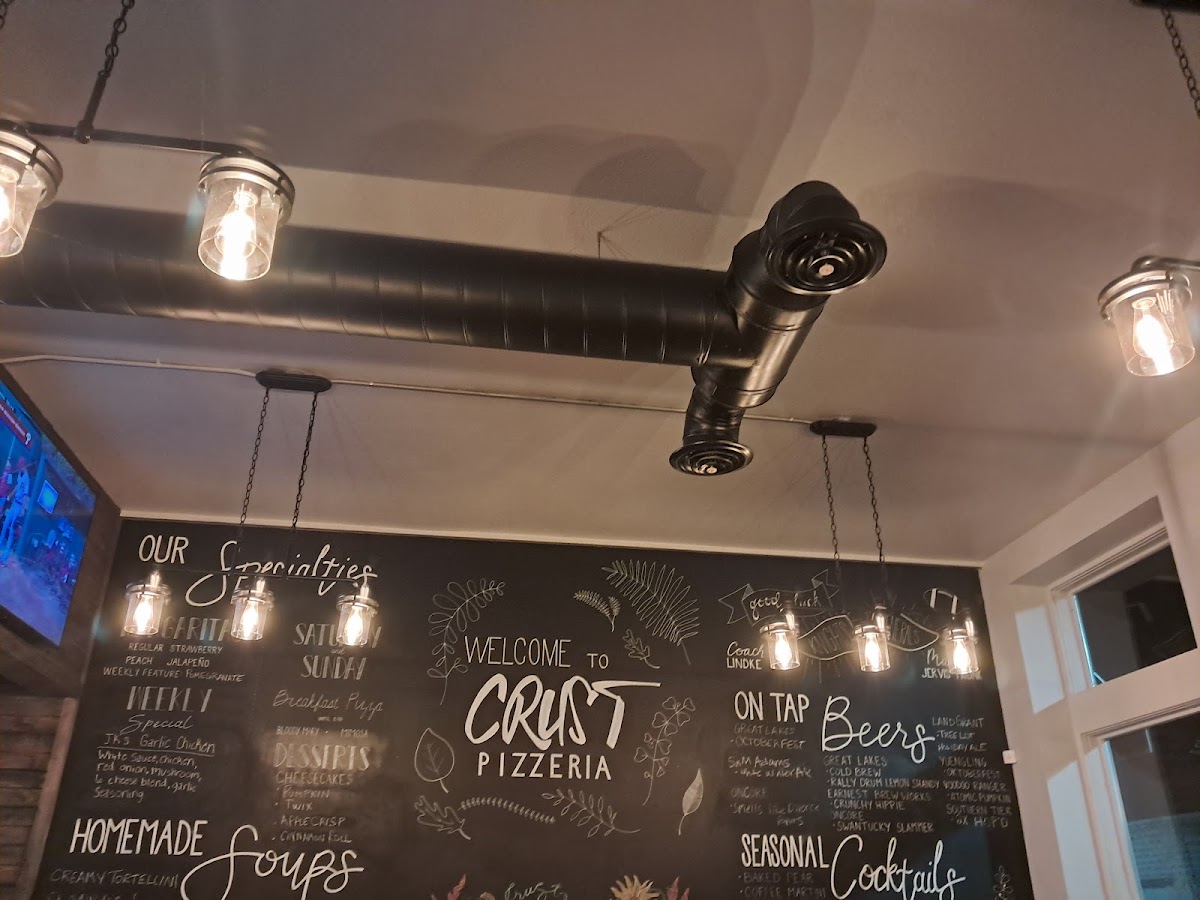 Crust Pizzeria menu board