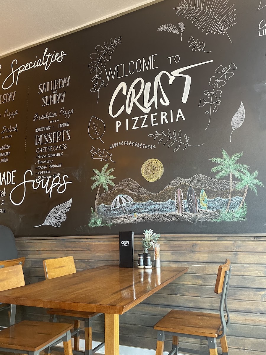 Crust Pizzeria menu board