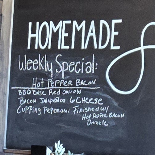 Crust Pizzeria menu board