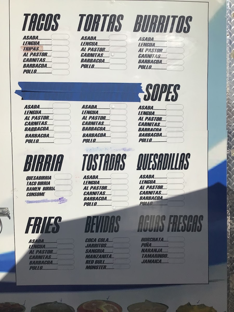 Tacos La Rancherita menu board