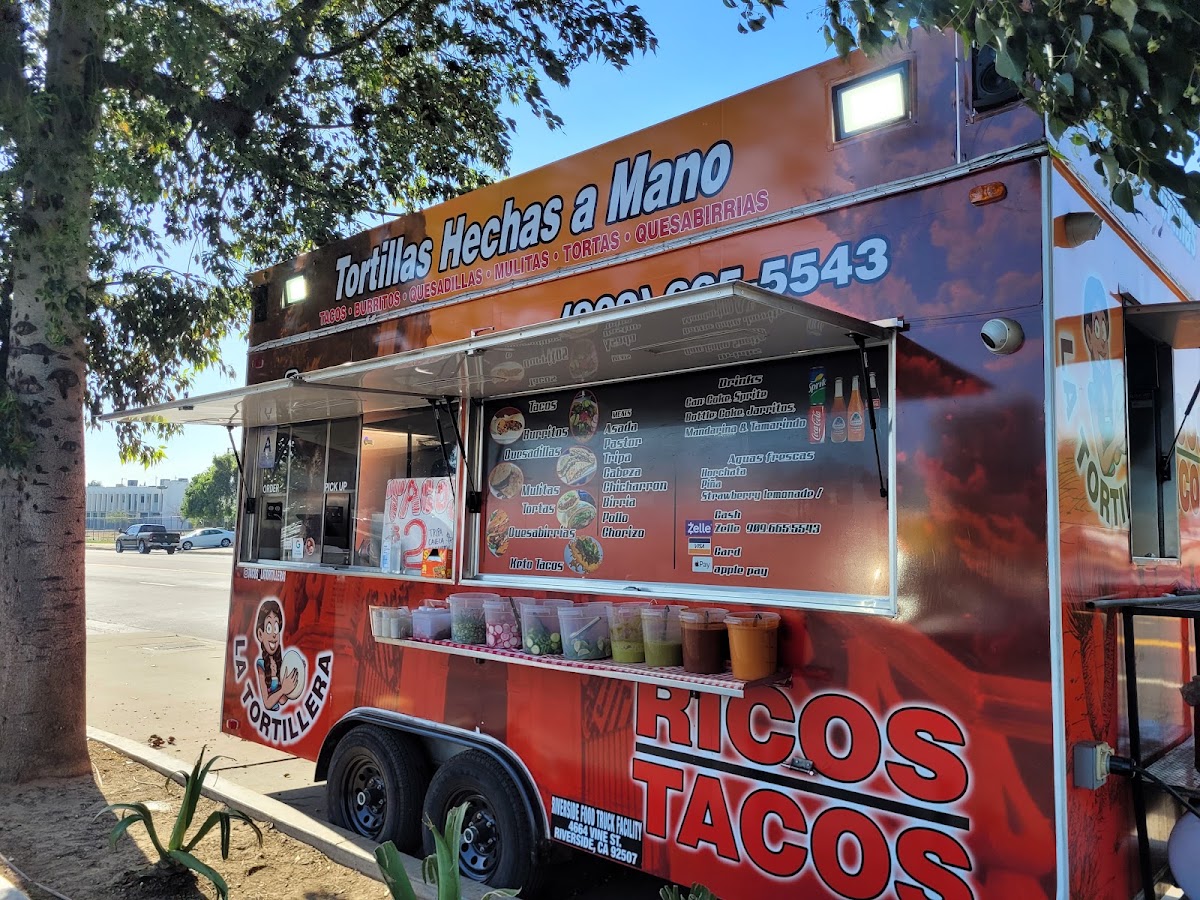 Ricos tacos Latortillera menu board