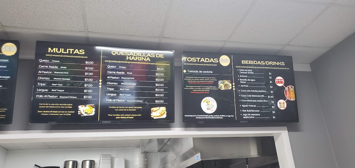 Tacos La Doña menu board