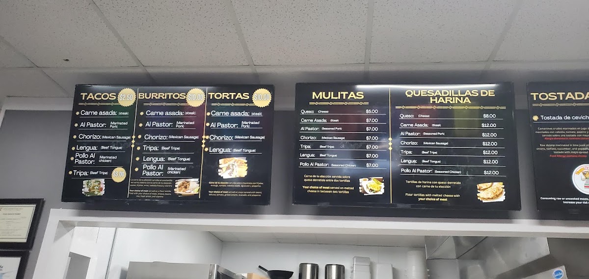 Tacos La Doña menu board